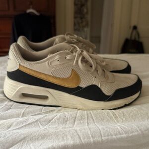 Nike Cream and Black Sneakers with Gold Accent